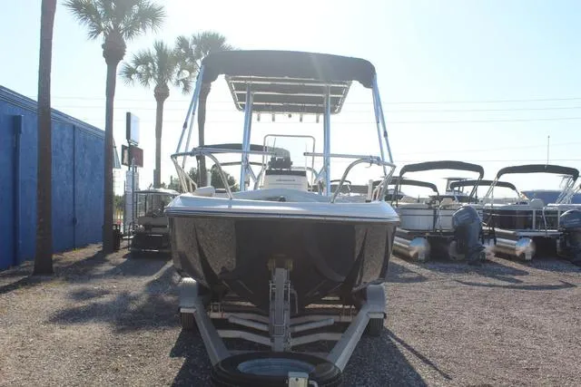 Slide: The Image of 2018 Bayliner Element F21 boat on a trailer in a marina. - 3