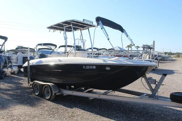 Slide: The Image of 2018 Bayliner Element F21 boat on a trailer with a Mercury outboard motor. - 4
