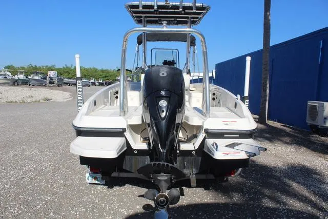 Slide: The Image of 2018 Bayliner Element F21 boat on a trailer with a Mercury outboard motor. - 6