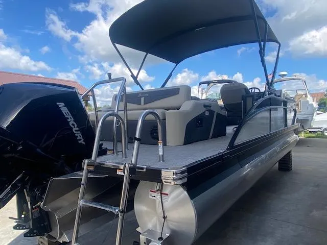 Slide: The Image of 2023 Barletta Cabrio 24 U pontoon boat with Mercury engine and canopy. - 10