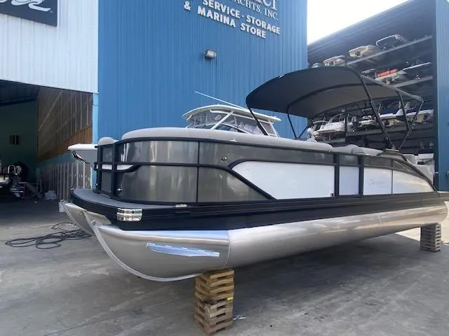 Slide: The Image of 2023 Barletta Cabrio 24 U pontoon boat at marina storage facility. - 4