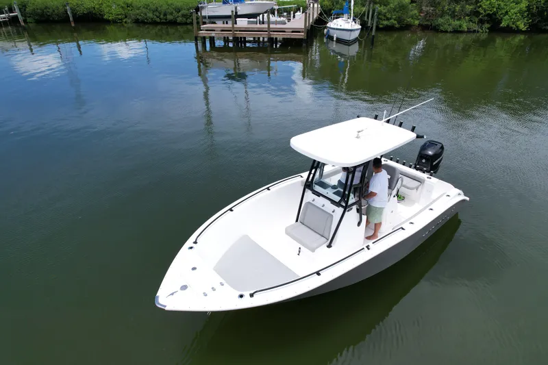 Slide: The Image of 2019 Cape Horn 22 OS boat on calm water near a dock. - 10