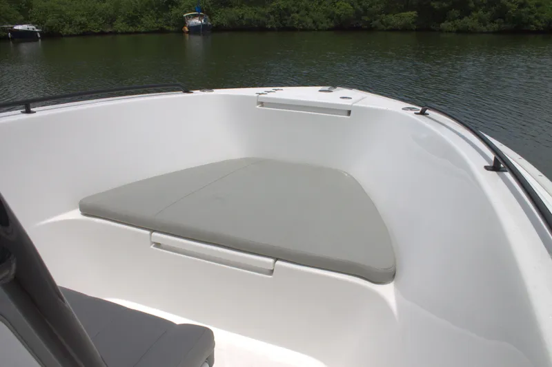 Slide: The Image of 2019 Cape Horn 22 OS boat with cushioned bow seating on calm water. - 15