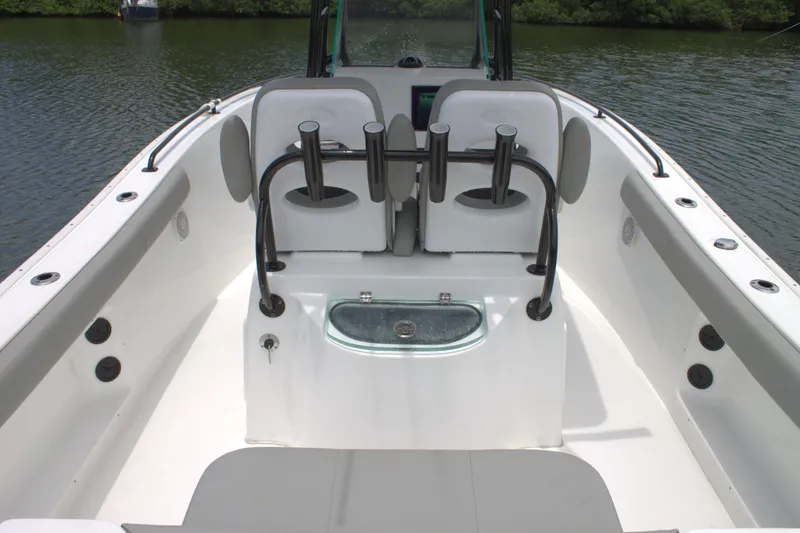 Slide: The Image of 2019 Cape Horn 22 OS boat interior with seating and rod holders. - 23