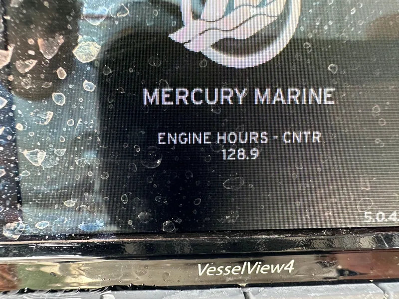 Slide: The Image of Mercury Marine VesselView4 display showing 128.9 engine hours on a 2019 Cape Horn 22 OS. - 27