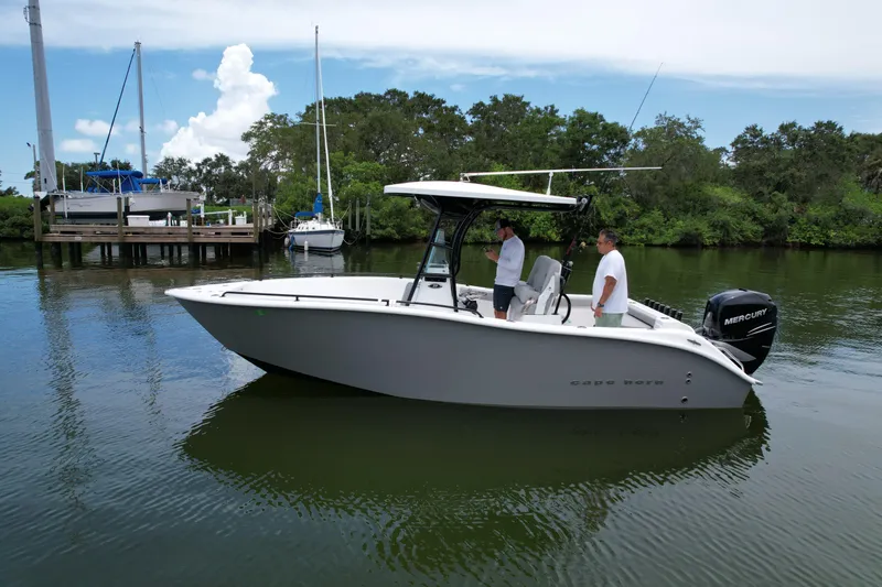 Slide: The Image of 2019 Cape Horn 22 OS boat on calm water with two people onboard. - 4