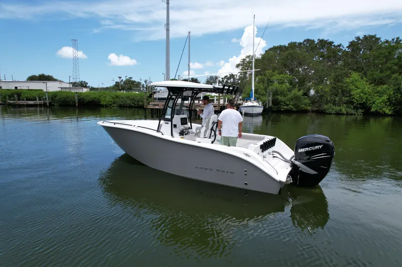Slide: The Image of 2019 Cape Horn 22 OS boat on water with two people onboard. - 5
