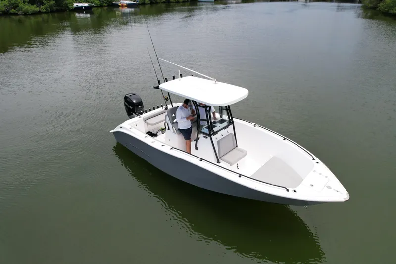 Slide: The Image of 2019 Cape Horn 22 OS boat on calm water with a person onboard. - 9