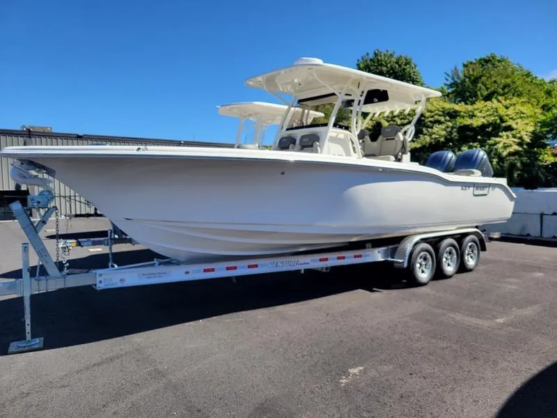 The Image of 2025 Key West 291 FS boat on trailer, parked outdoors. - 1