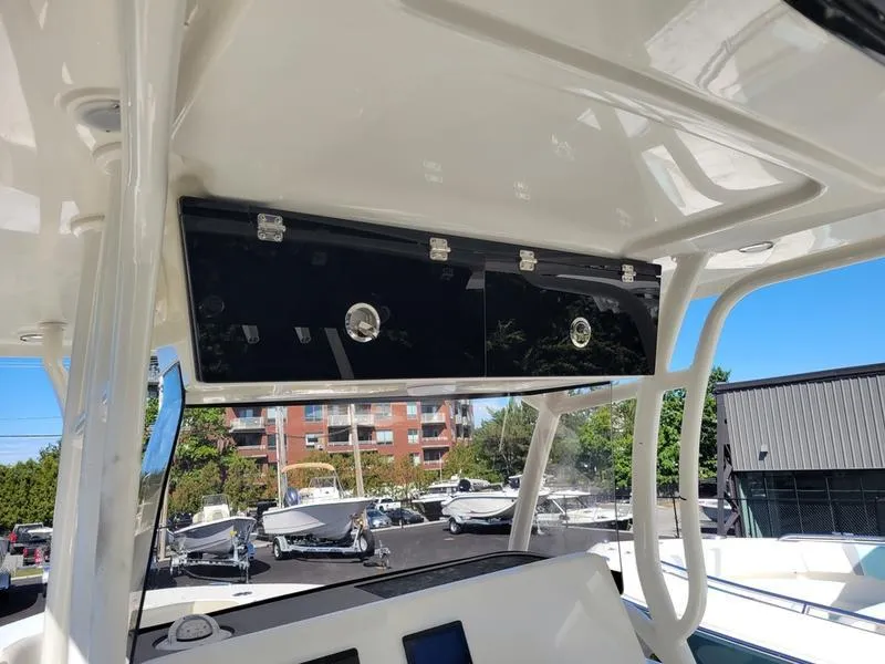 Slide: The Image of 2025 Key West 291 FS boat interior with overhead storage and modern design. - 15