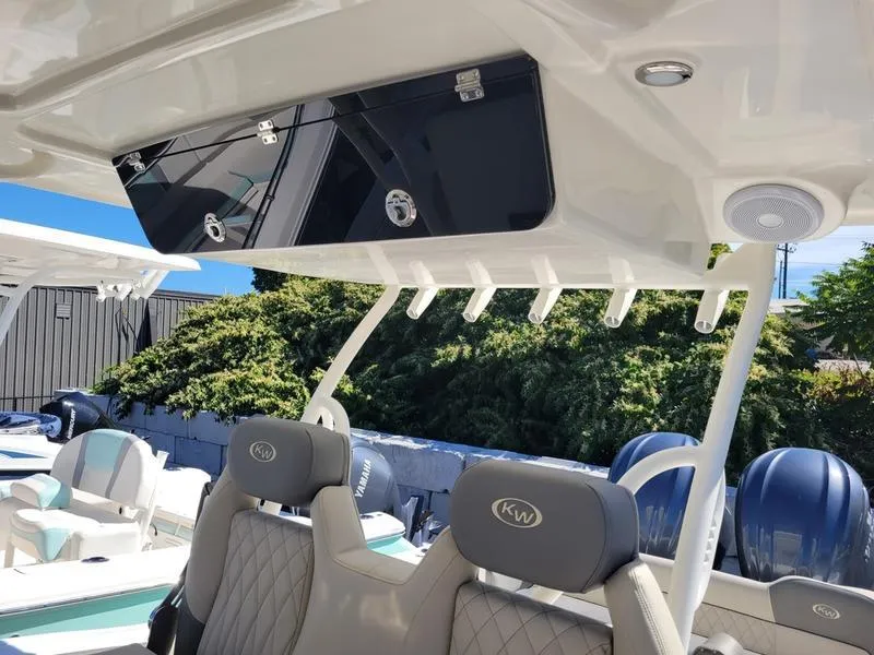 Slide: The Image of 2025 Key West 291 FS boat interior with luxury seating and overhead storage. - 18