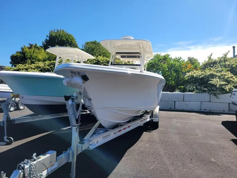 Slide: The Image of 2025 Key West 291 FS boat on trailer, sunny day, outdoor display. - 3