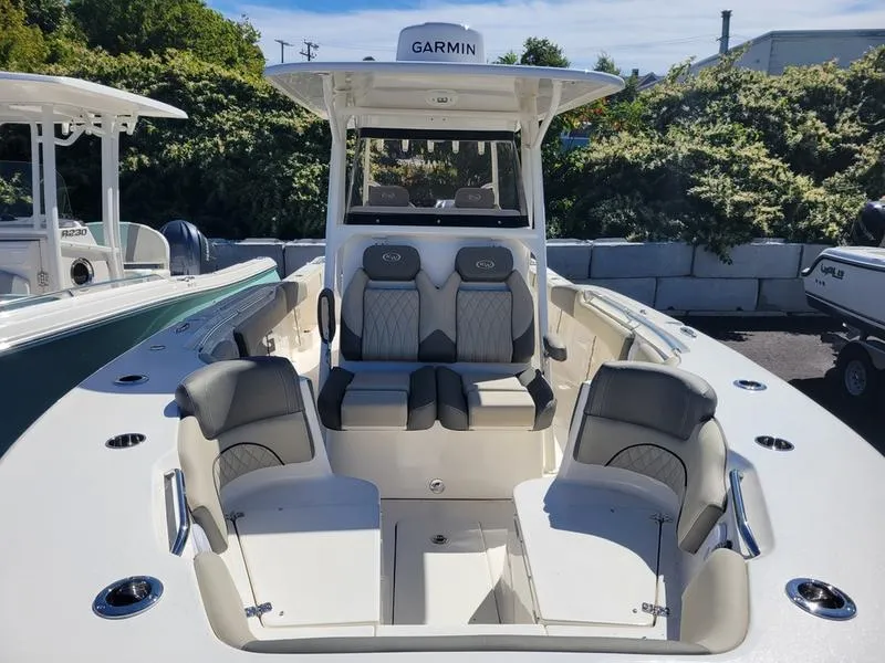 Slide: The Image of 2025 Key West 291 FS boat with Garmin navigation, featuring spacious seating and modern design. - 7