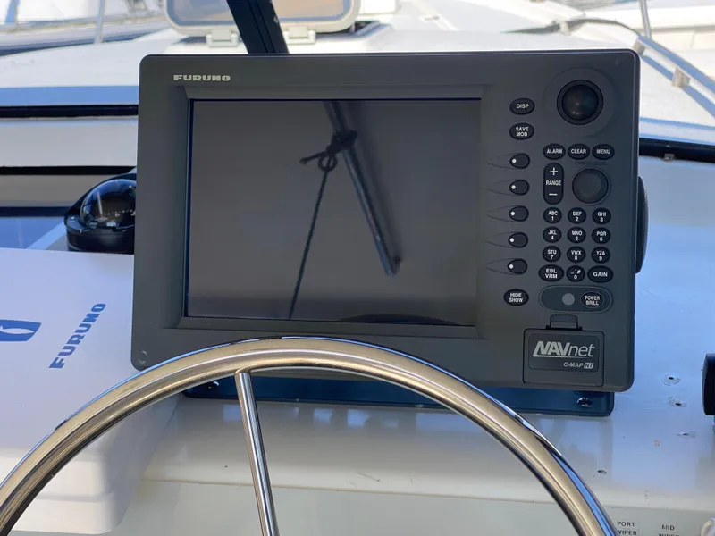 Slide: The Image of Furuno navigation system on 1986 Luhrs Alura boat dashboard. - 10