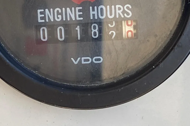 Slide: The Image of VDO engine hour meter showing 182 hours on a 1986 Luhrs Alura boat. - 18
