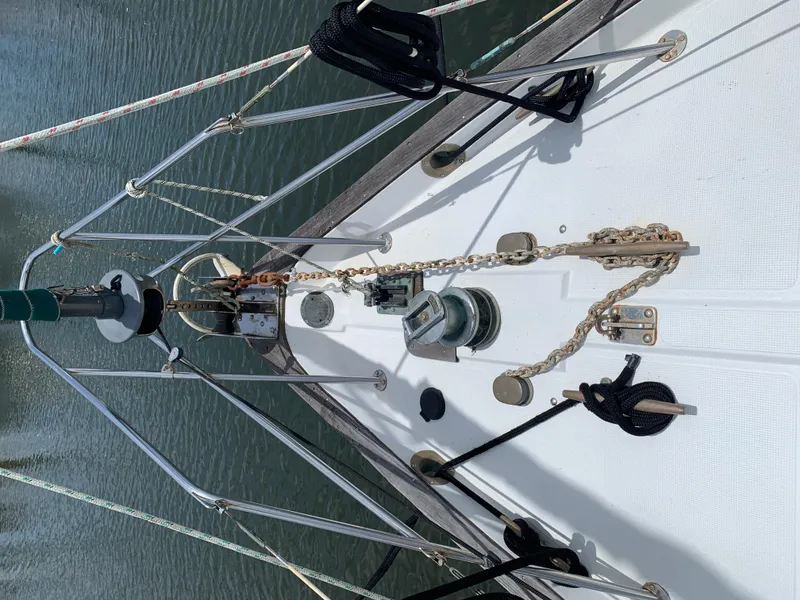 Slide: The Image of 1988 Pacific Seacraft Cutter bow with anchor chain and deck fittings. - 4