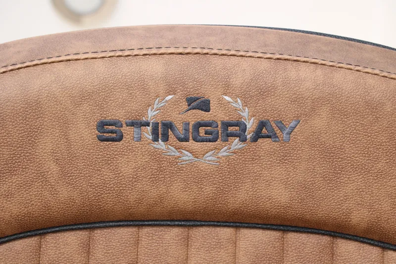 Slide: The Image of Stingray 212SC 2020 model logo on brown leather upholstery. - 17
