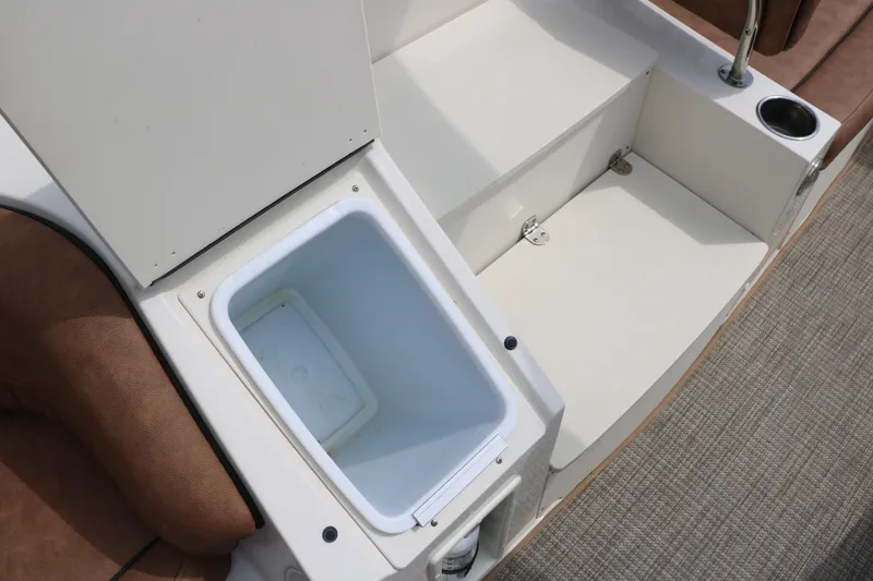Slide: The Image of 2020 Stingray 212SC boat interior with open storage compartment. - 20