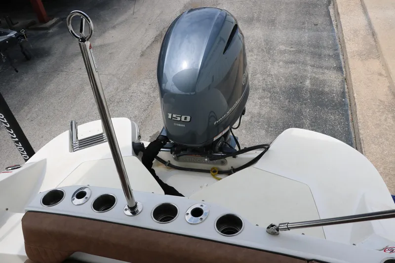 Slide: The Image of 2020 Stingray 212SC boat with Yamaha 150 outboard motor. - 29