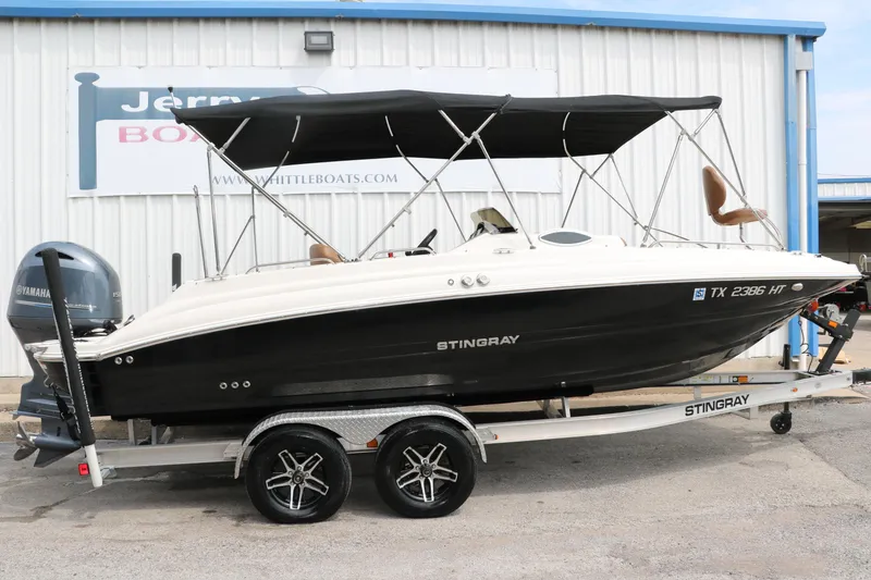 Slide: The Image of 2020 Stingray 212SC boat on trailer with Yamaha outboard motor. - 33