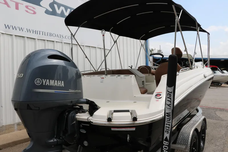 Slide: The Image of 2020 Stingray 212SC boat with Yamaha outboard motor at Whittle Boats dealership. - 36
