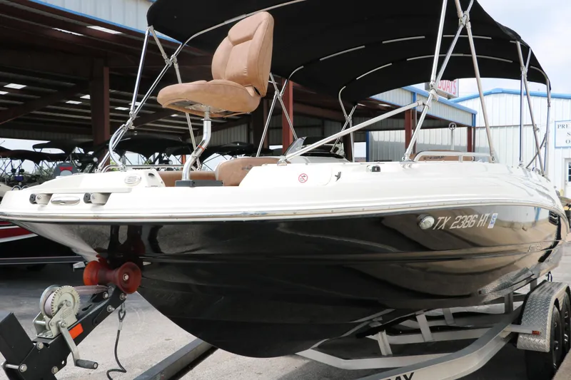 Slide: The Image of 2020 Stingray 212SC boat on trailer with canopy and seating. - 41