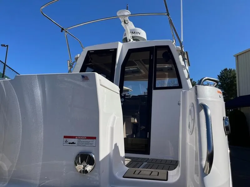 Slide: The Image of 2025 Cutwater C-248 C Coupe boat, rear view, showcasing sleek design and modern features. - 15