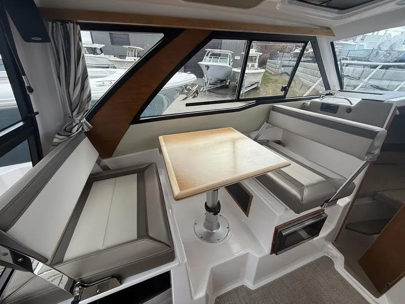 Slide: The Image of Interior of 2025 Cutwater C-248 C Coupe with seating and table. - 13