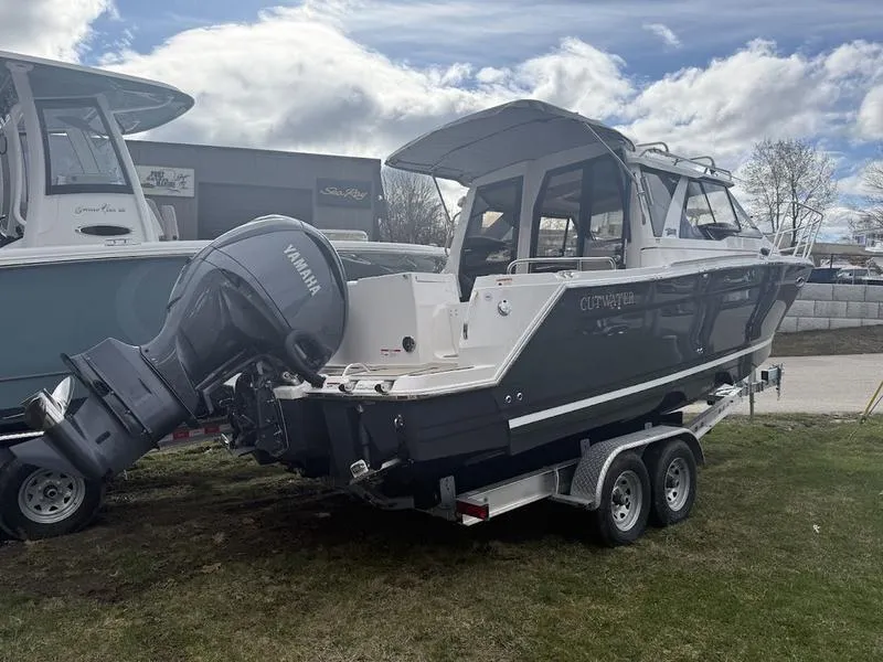 Slide: The Image of 2025 Cutwater C-248 C Coupe boat on trailer with Yamaha outboard motor. - 5