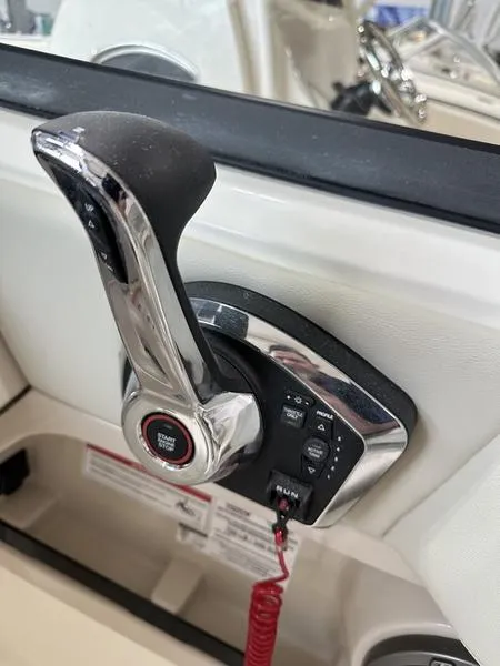 Slide: The Image of 2024 Boston Whaler 240 Vantage throttle control, sleek chrome finish, ergonomic design. - 12