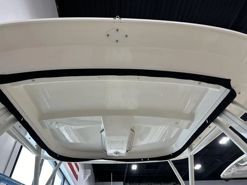 Slide: The Image of 2024 Boston Whaler 240 Vantage boat roof, interior view, in showroom. - 13