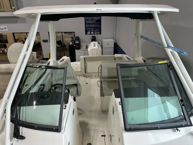 Slide: The Image of 2024 Boston Whaler 240 Vantage boat interior with dual consoles and seating. - 17