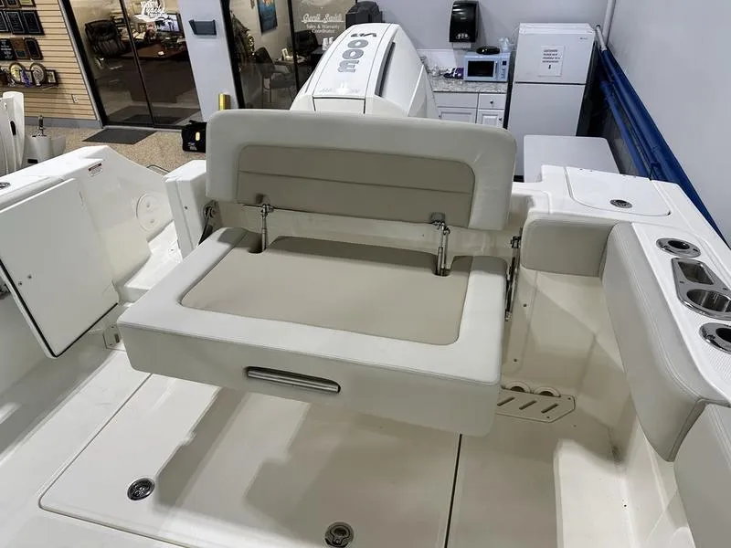 Slide: The Image of 2024 Boston Whaler 240 Vantage boat interior with foldable seating. - 7