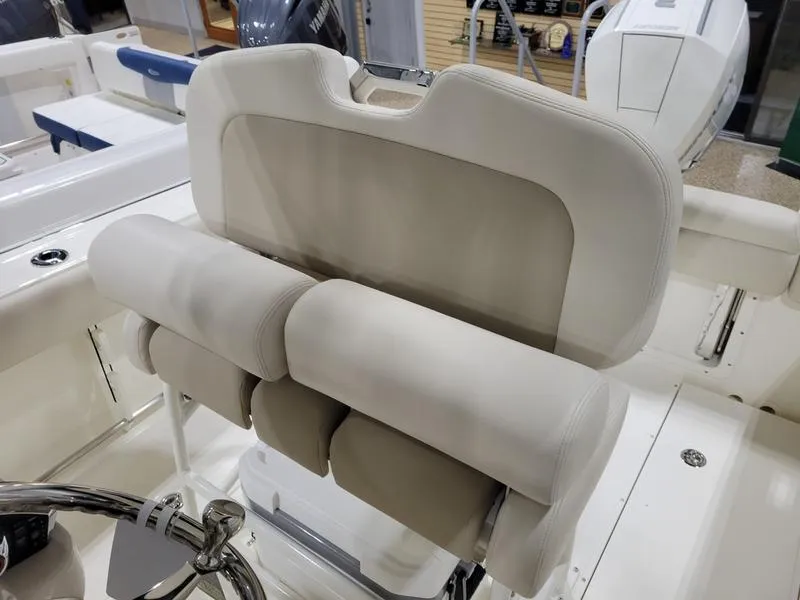 Slide: The Image of 2025 Boston Whaler 230 Outrage boat seating and helm detail. - 13