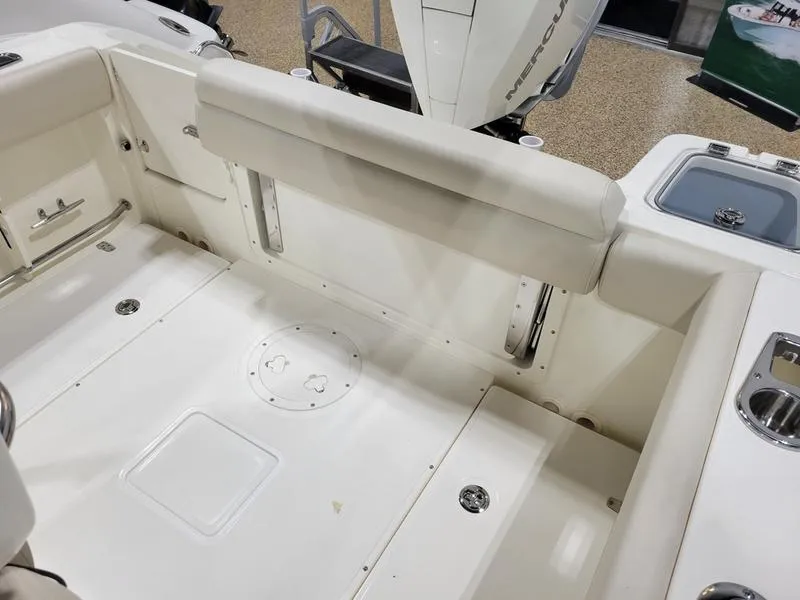 Slide: The Image of 2025 Boston Whaler 230 Outrage boat interior with seating and storage compartments. - 14