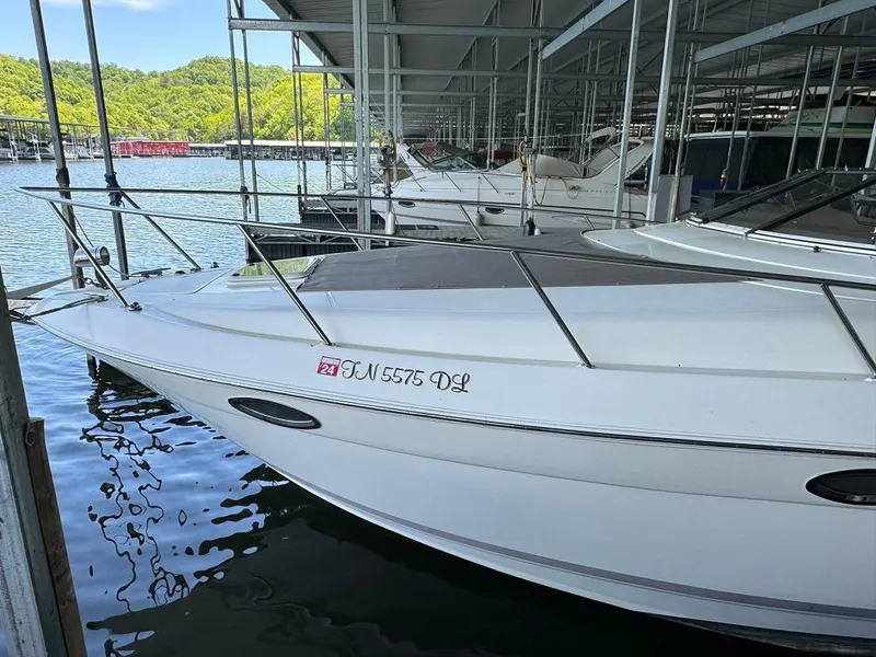 Slide: The Image of 2004 Regal 3260 Commodore docked at a marina. - 10