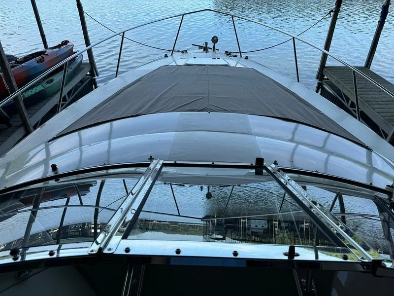 Slide: The Image of 2004 Regal 3260 Commodore boat docked, view from the bow. - 25