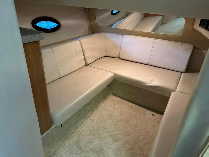 Slide: The Image of 2004 Regal 3260 Commodore interior with beige leather seating. - 39