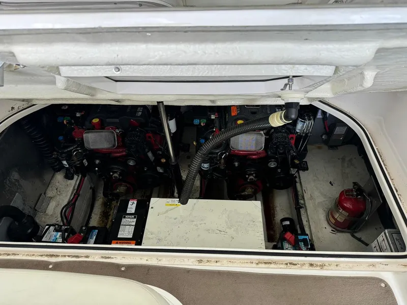 Slide: The Image of 2004 Regal 3260 Commodore engine compartment with dual engines and fire extinguisher. - 47