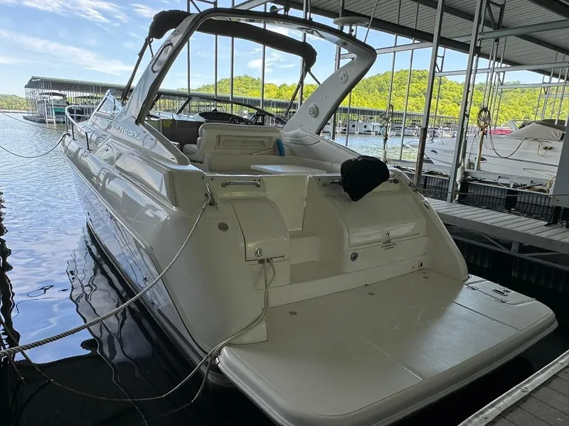 Slide: The Image of 2004 Regal 3260 Commodore docked at a marina. - 9