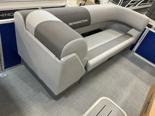 Slide: The Image of 2024 Bennington 22 SVL pontoon boat interior with gray seating and spacious layout. - 10