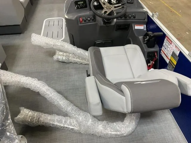 Slide: The Image of 2024 Bennington 22 SVL boat dashboard with steering wheel and control panel. - 13