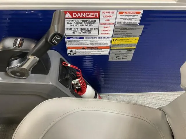 Slide: The Image of Storage compartment of 2024 Bennington 22 SVL boat with plastic-wrapped item inside. - 16