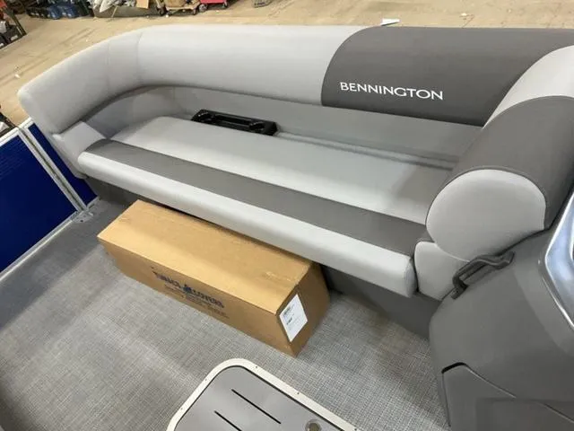 Slide: The Image of 2024 Bennington 22 SVL pontoon boat interior with gray and white seating. - 9