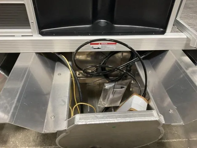 Slide: The Image of 2024 Bennington 22 SVS pontoon boat interior with grey seating and helm station. - 11