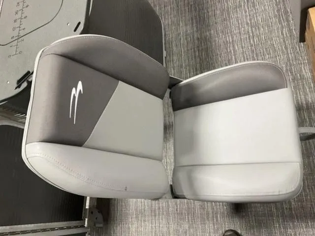 Slide: The Image of 2024 Bennington 22 SVS boat seat, gray and white upholstery, top view. - 13