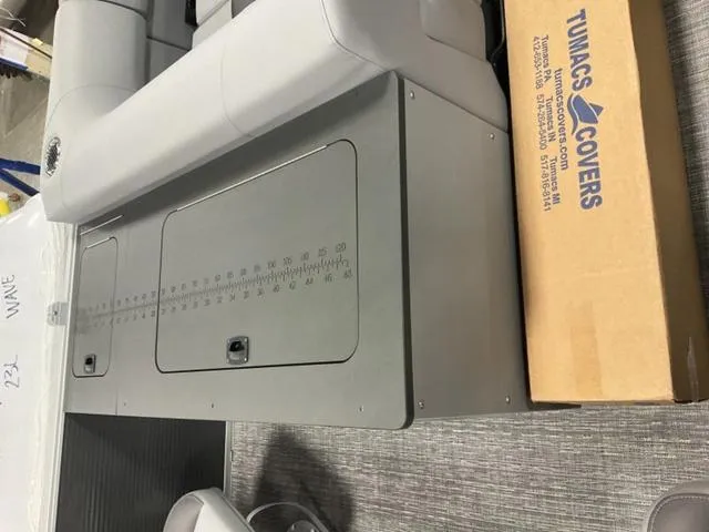 Slide: The Image of 2024 Bennington 22 SVS boat interior with gray seating and table. - 15