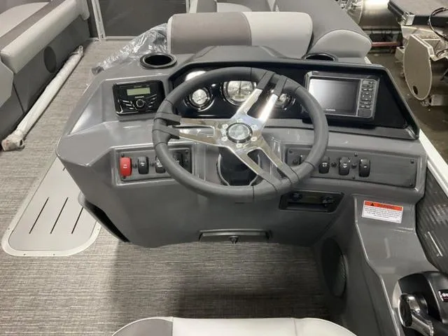 Slide: The Image of Control panel and safety warnings on a 2024 Bennington 22 SVS boat. - 18