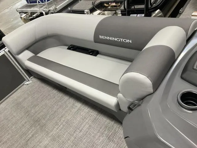 Slide: The Image of 2024 Bennington 22 SVS pontoon boat interior with gray and white seating. - 23
