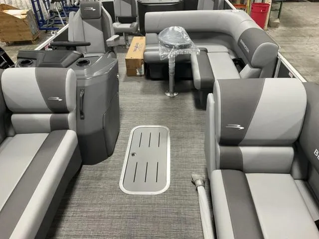 Slide: The Image of 2024 Bennington 22 SVS pontoon boat interior with gray seating and modern design. - 24
